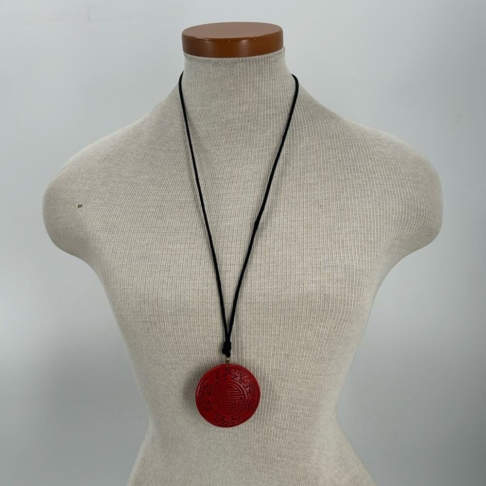 Carved Cinnabar red circle pendant